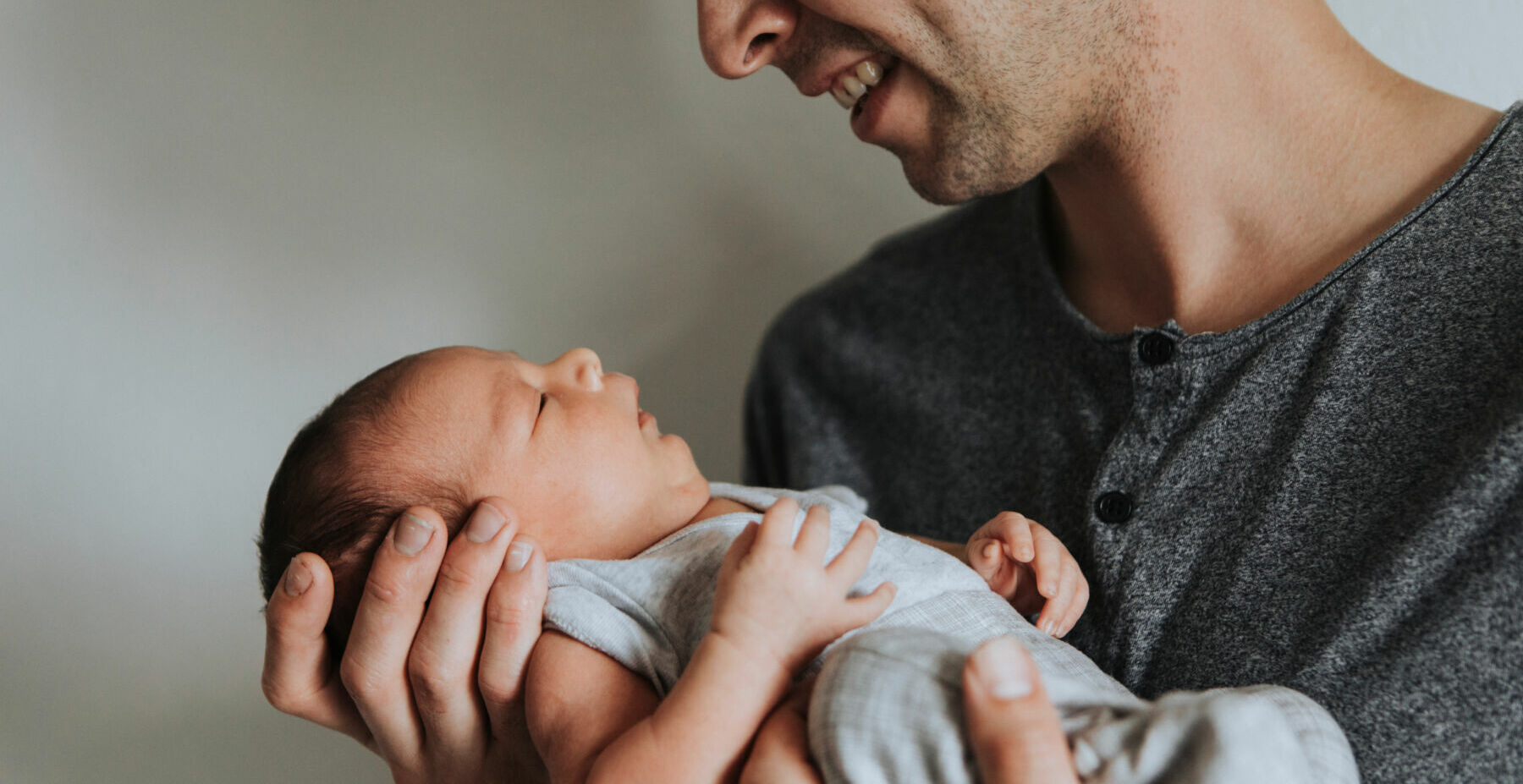 Young father holding his baby